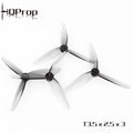 Quatre hélices HQProp T3.5X2.5X3 transparentes fumées à 3 pales pour drone FPV.